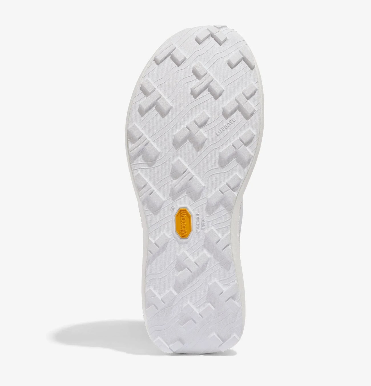 Semelle blanche avec reliefs géométriques.