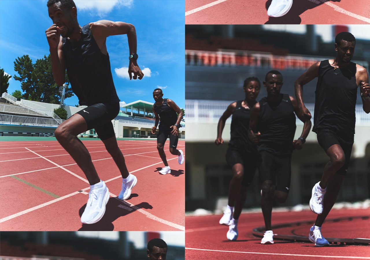 Athlètes courant sur piste d'athlétisme extérieure.